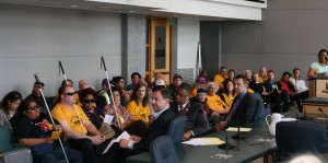 The Councilmembers listen to a delegate testifying to the need for lower transit fares.